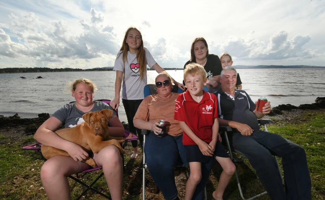 HOLIDAY MODE: Dakota Cornie, Kylah Vipen, Rhyley Vipen, Cassidy Wadley, Kelly Wadley, Ely Wadley with dog Lacey and Cameron Vipen were enjoying an early start to the long weekend at Lake Keepit on Thursday. Photo: Gareth Gardner