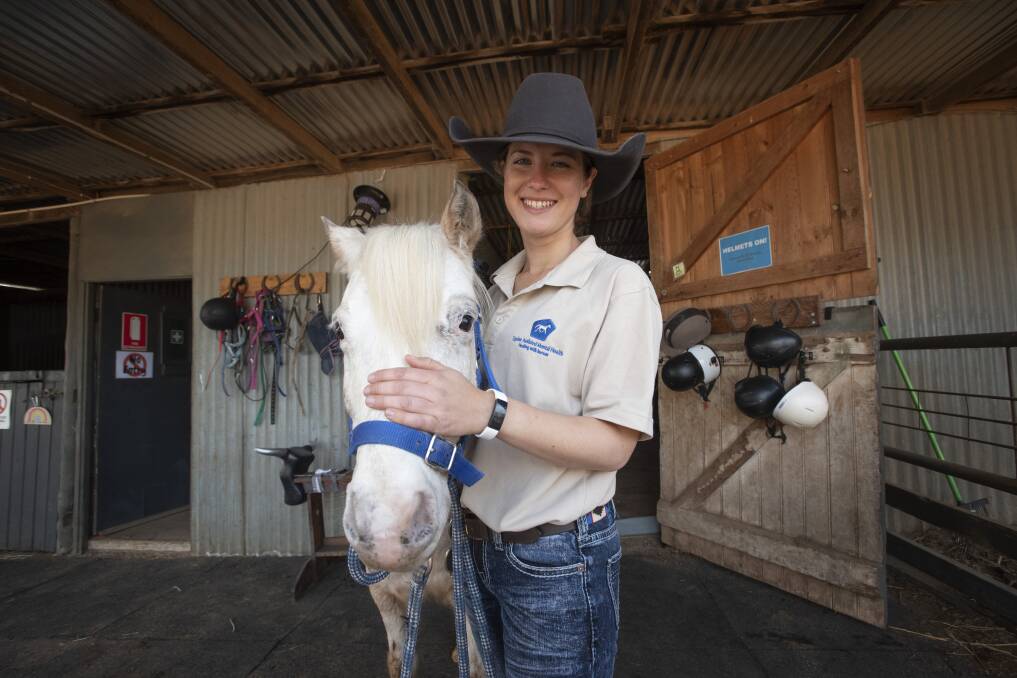 BOND: Brooke shares a special bond with the horses she works with through her equine assisted therapy business. Photo: Peter Hardin 140721PHA044