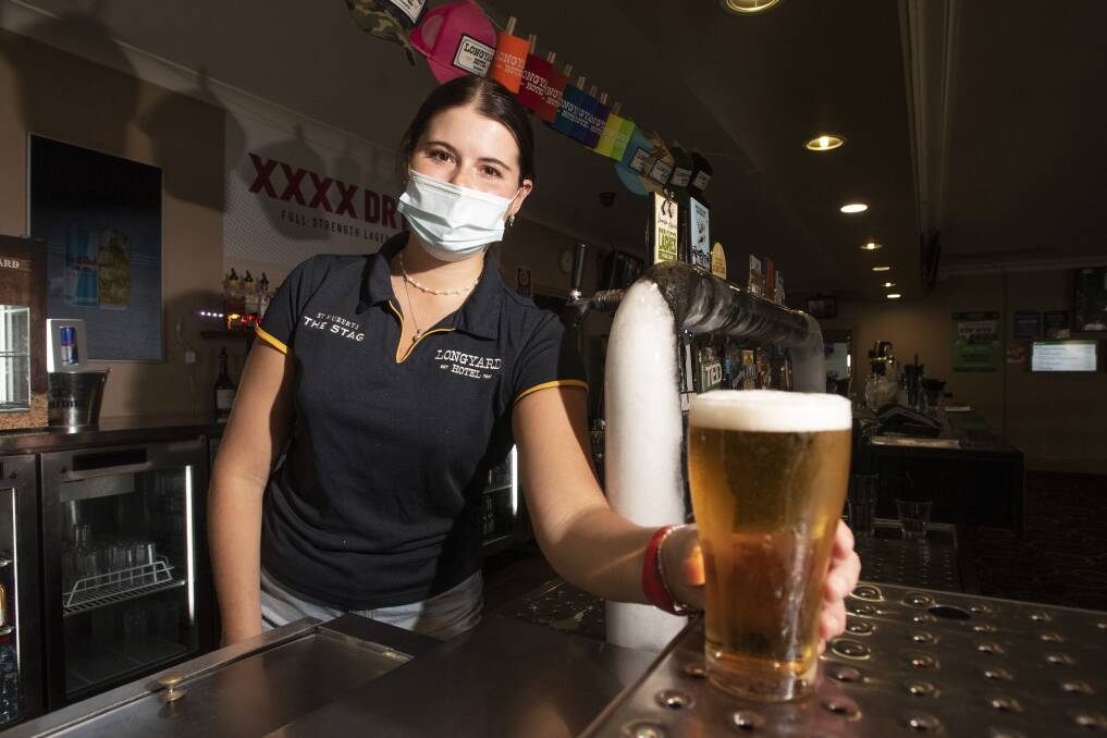 UPSKILLING: Staff member Ella Anderson behind the bar at The Longyard Hotel. Photo: Peter Hardin