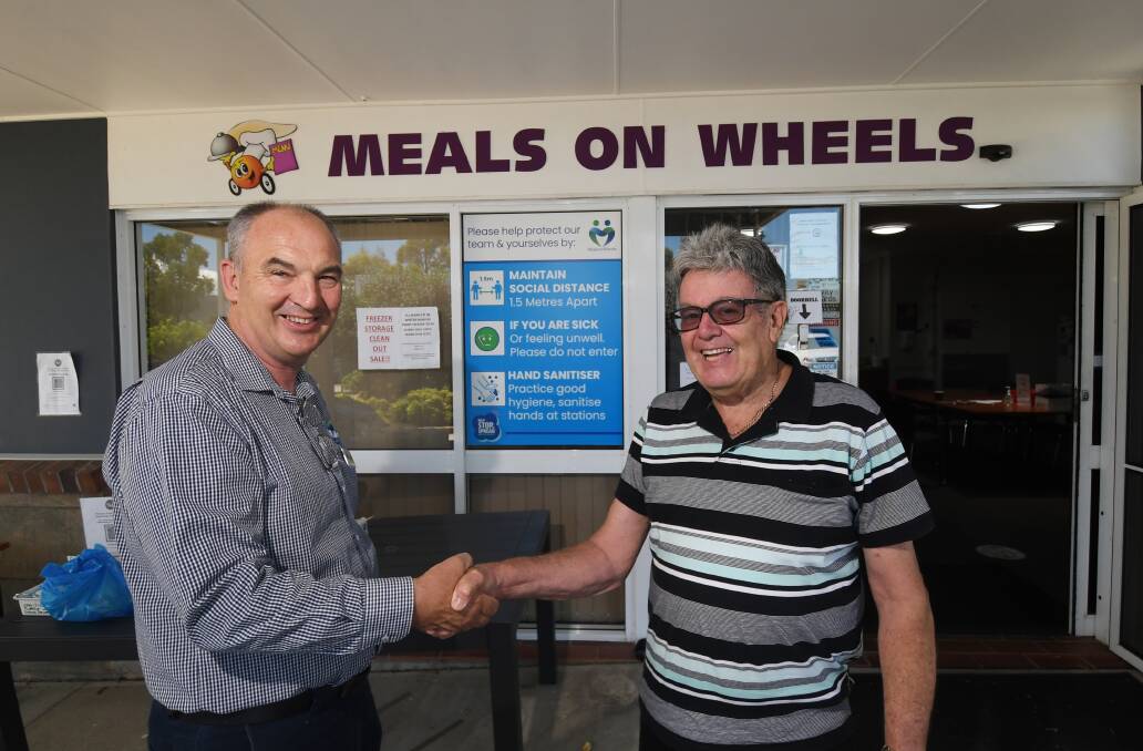 JOB WELL DONE: Peter Gallagher and Denis Costigan were happy to receive some extra funding for Tamworth Meals on Wheels, which has recently seen a big increase in customers. Photo: Gareth Gardner