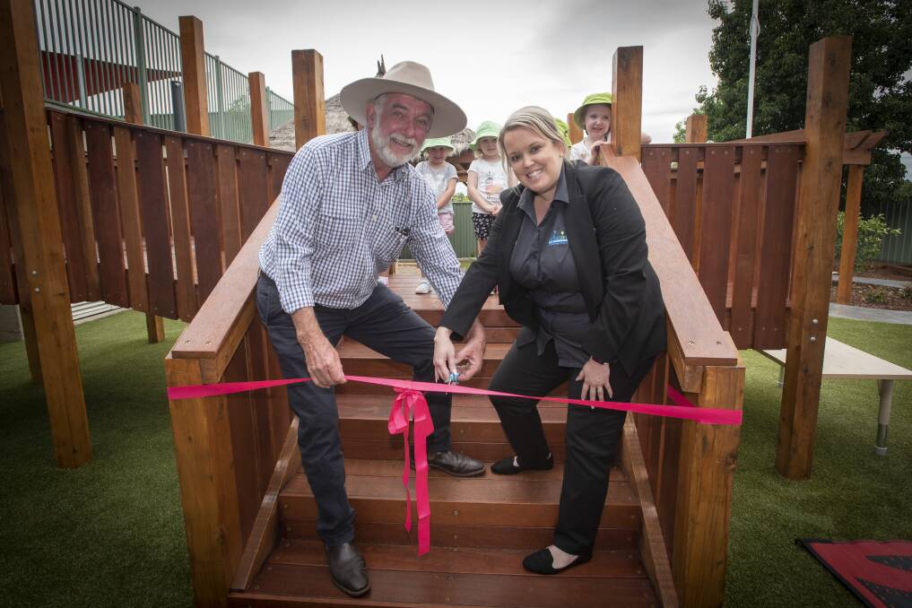 GRAND OPENING: Tamworth Regional Council mayor Russell Webb and Milestones area manager Krista Lynch opening the new playground. Photo: Peter Hardin