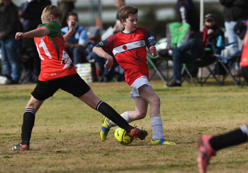 GOOD TACKLE: There were plenty of aspiring Matildas and Socceroos at the National Primary Games in Tamworth over the weekend. Photo: Gareth Gardner 100721GGA45