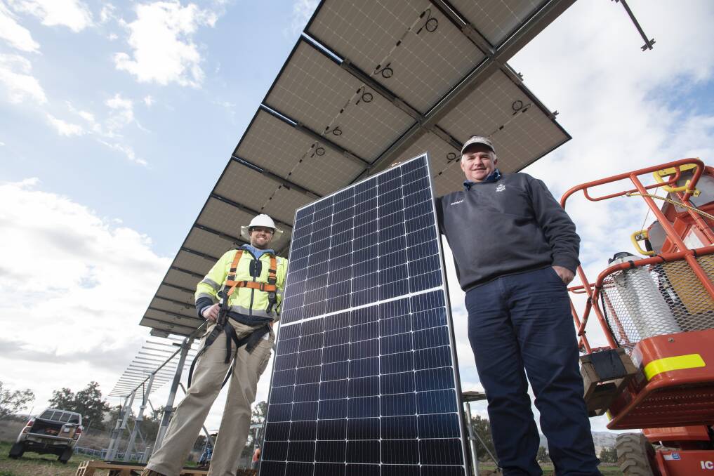 SOLAR POWER: Ben Wynn and Andrew Eather are glad Farrer is part of a new pilot program from the NSW government. Photo: Peter Hardin 260721PHD004