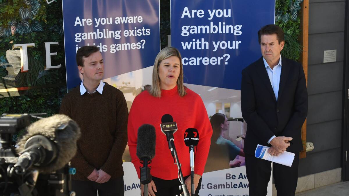 CRACKING DOWN: Local counsellor Jake Plowes, Director of the Office of Responsible Gambling Natalie Wright, and Minister for Hospitality and Racing Kevin Anderson. Photo: Gareth Gardner