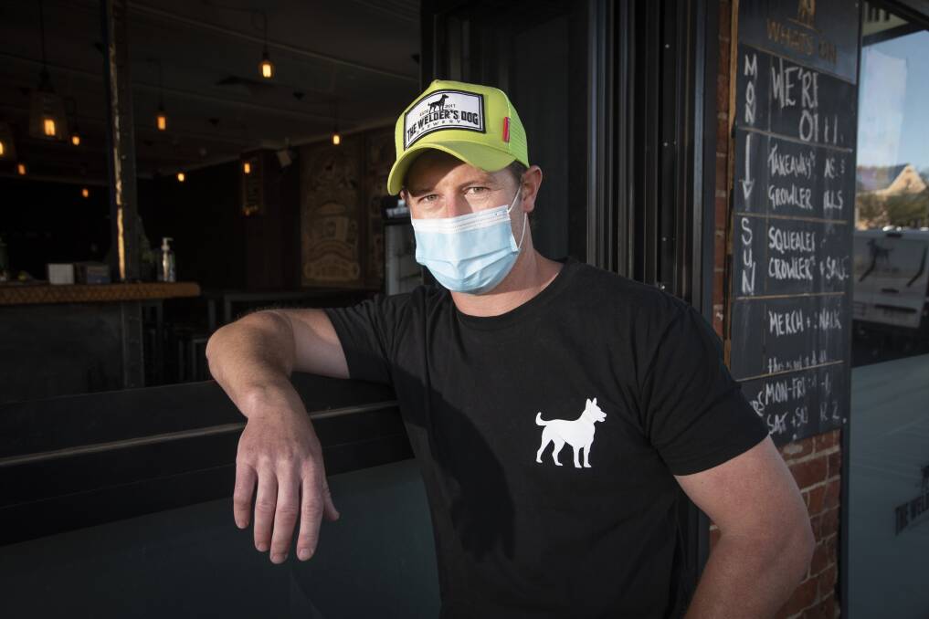 BAR-ELY HANGING ON: The Welder's Dog owner Ben Coombes is concerned about people's mental health and wants to see a positive, care-free atmosphere return to his bar soon. Photo: Peter Hardin 070921PHE008