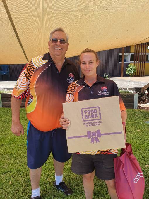 GIVING SEASON: Winanga-Li CEO Wayne Griffiths and playgroup officer Breanna Cathro were thrilled to help Foodbank deliver their holiday hampers. Photo courtesy of Winanga-Li.