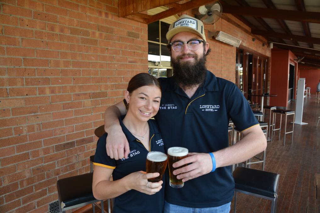 New Years Cheers: The Longyard Hotel workers Ellie New and Jed Hubble are looking forward to a better year in 2022. Photo: Cody Tsaousis