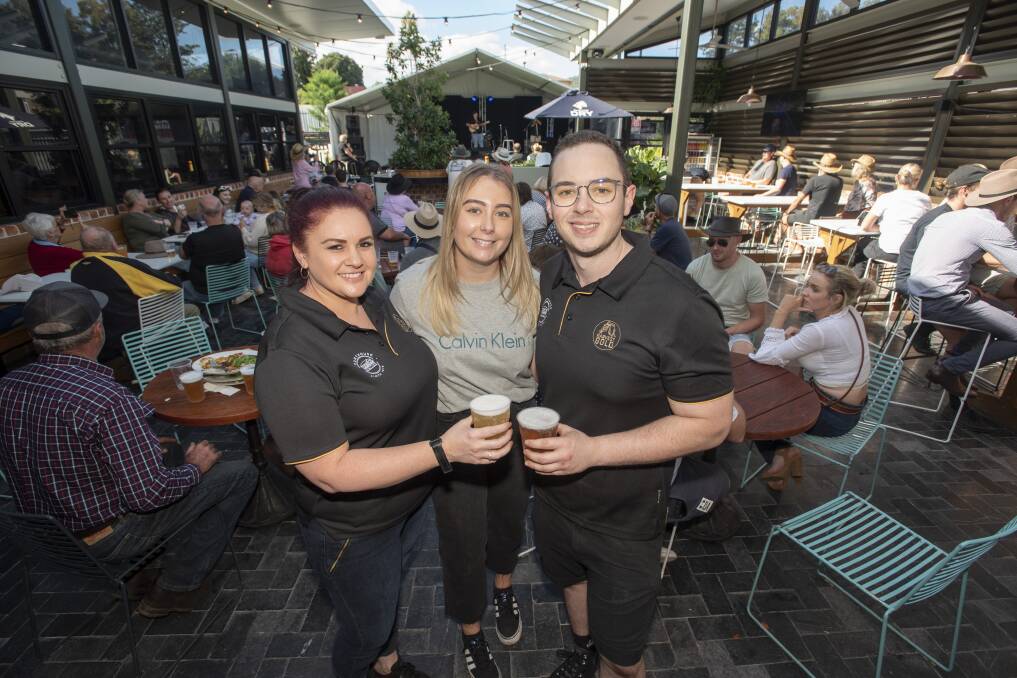HUGE WEEK: Sam Potter, Alana Dickinson and Will Allen from The Courthouse Hotel have had their hands full throughout the week, with thousands of customers coming through the door. Photo: Peter Hardin