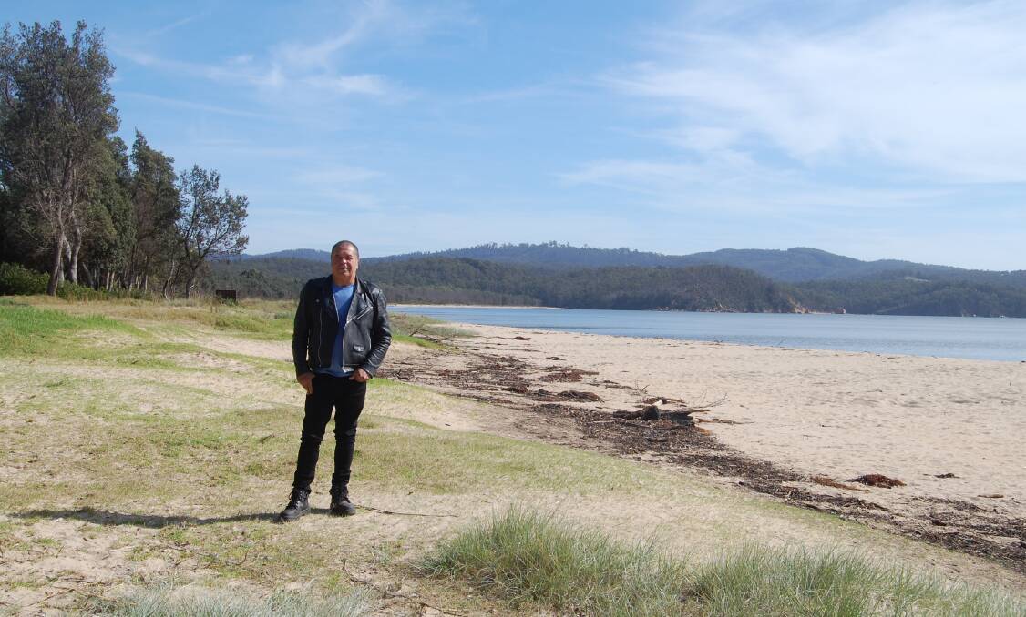 Monaroo Elder BJ Cruse on the shores of Twofold Bay at what is currently known as Boydtown. Mr Cruse said the owners' decision is a show of respect to Aboriginal people and those who suffered at the hands of Boyd. Photo: Leah Szanto