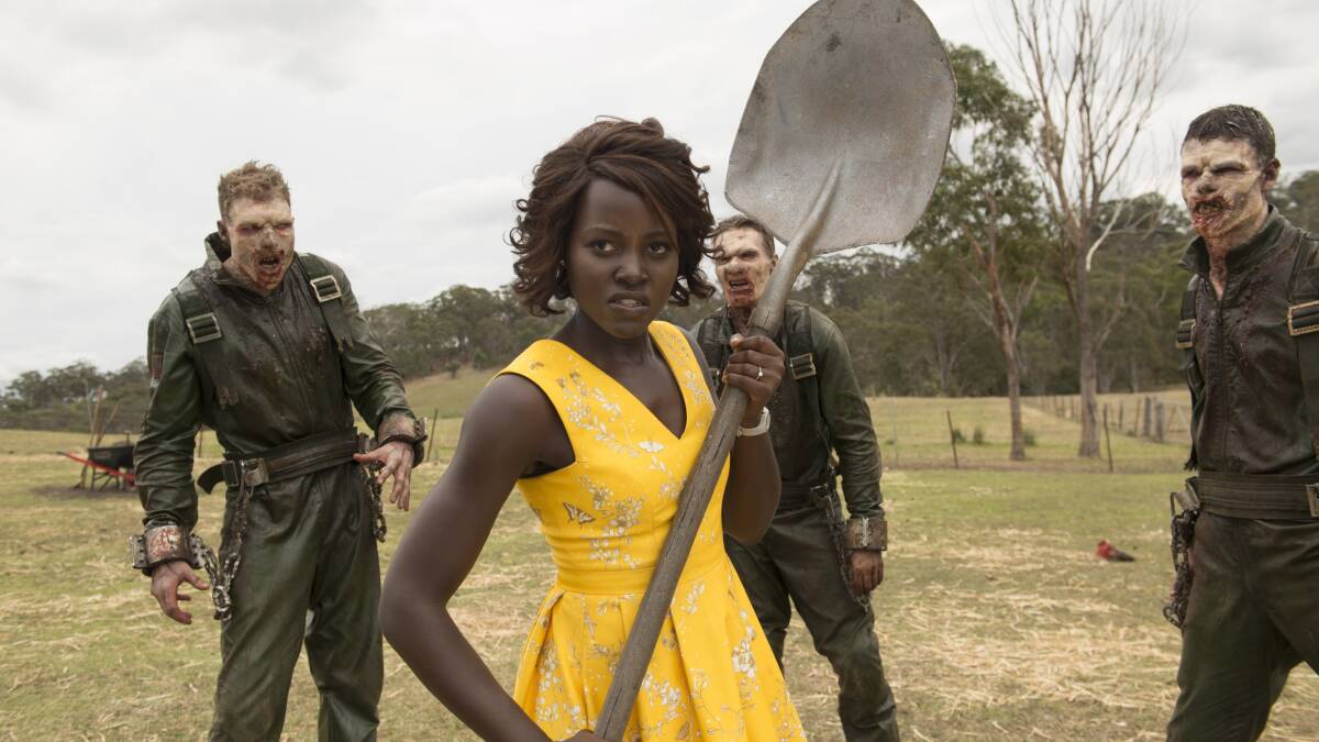 Lupita Nyong'o, centre, as school teacher Miss Caroline in Little Monsters. Picture: Simon Cardwell