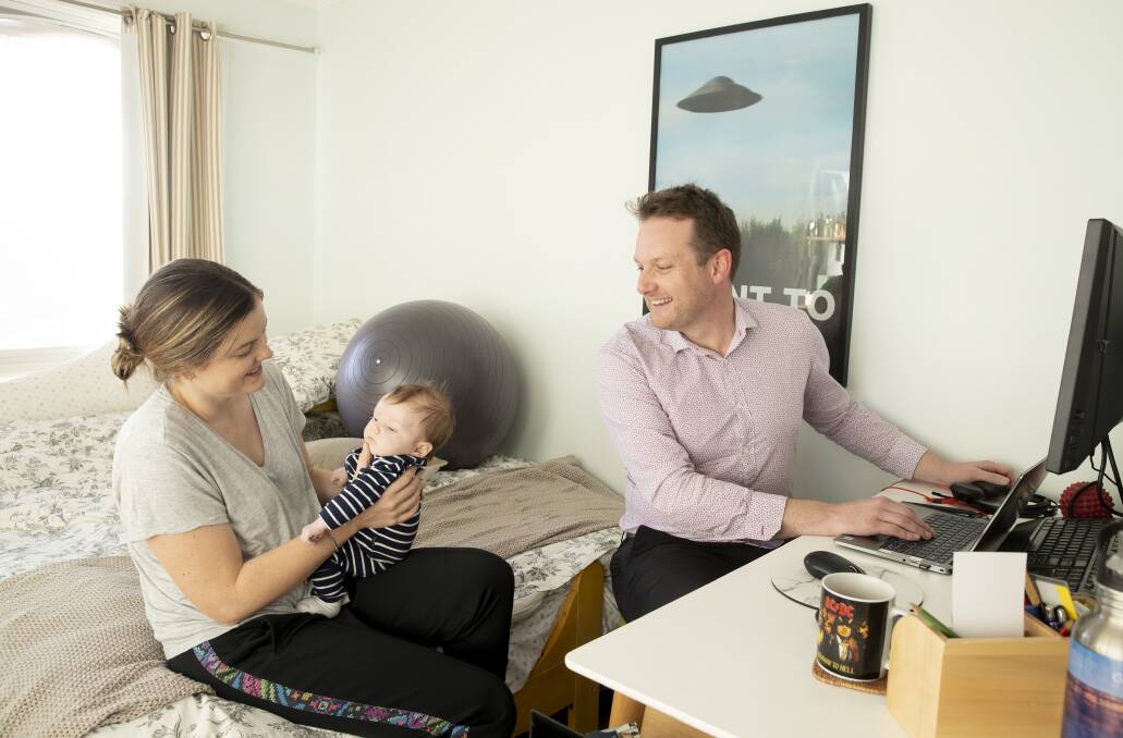 Department of Industry, Science, Energy and Resources public servant Miles Davis is juggling working from home with raising nine-week-old Morgan with his wife Sophie. Picture: Sitthixay Ditthavong