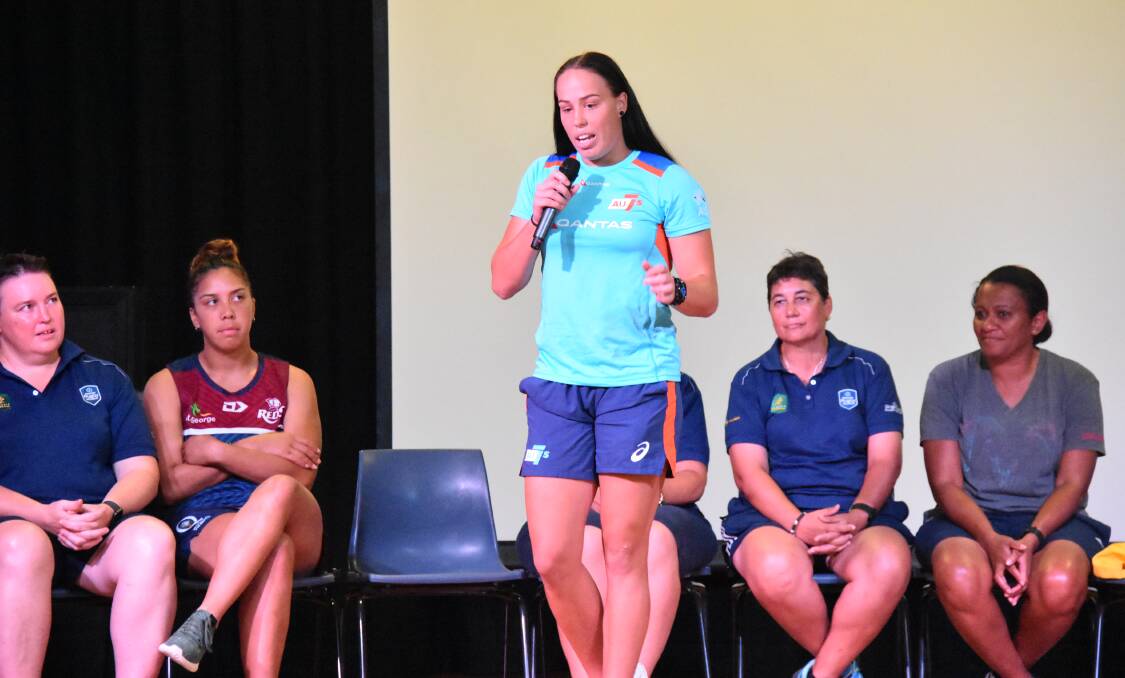 Rhiannon Byers lists the places she's been able to travel through playing rugby to an audience of young Moree players. 