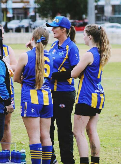 Passionate: Sonia Martin (centre) coaching the first ever North West Youth Girls rep team in 2018. She now volunteers as the AFL North West NSW president.