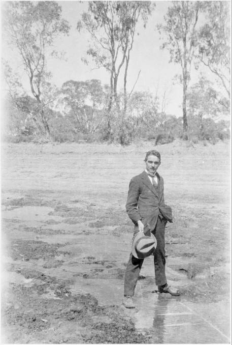 River Murray Commissioner Sir Ronald East standing astride the Murray River in 1923 at Nyah, Victoria. At the time, upstream irrigation was diverting 1000ML/day. 