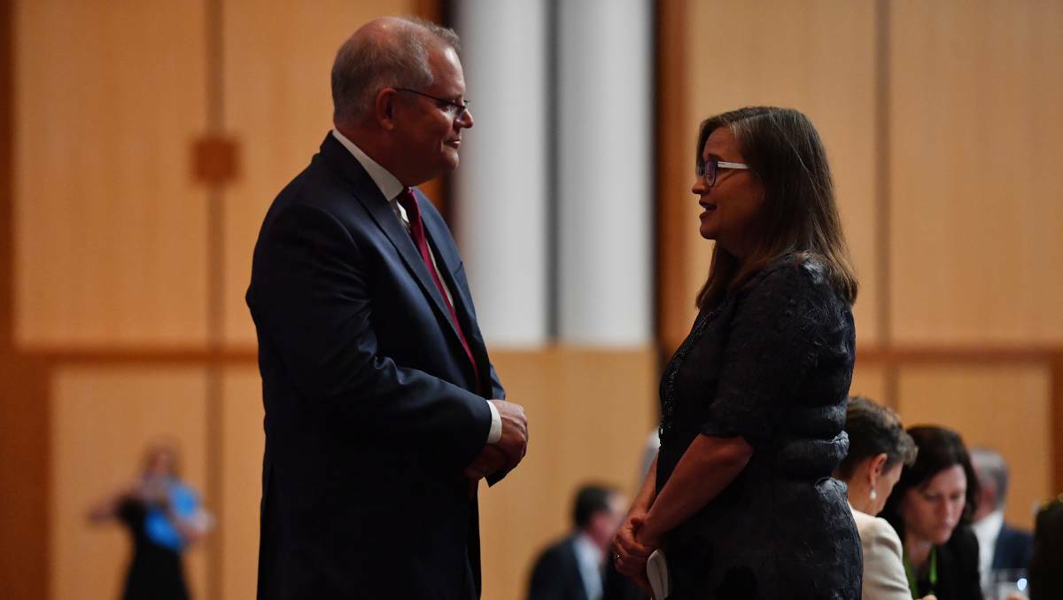 Prime Minister Scott Morrison (left) speaks with Sex Discrimination Commissioner Kate Jenkins during the International Women's Day Parliamentary Breakfast in the Great Hall at Parliament House. Picture: Getty Images