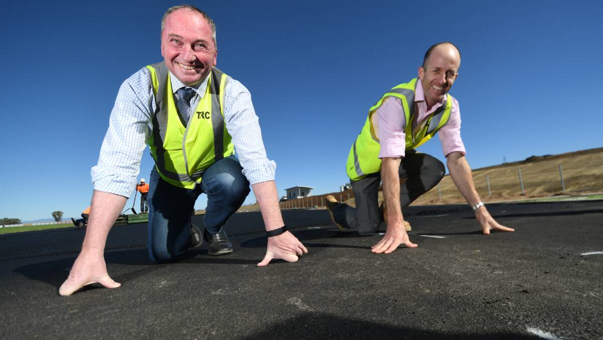 RACE TO FINISH LINE: Member for New England Barnaby Joyce with Tamworth Regional Council project manager Mark Gardiner at the Northern Inland Sporting Centre of Excellence site. Photo: Gareth Gardner