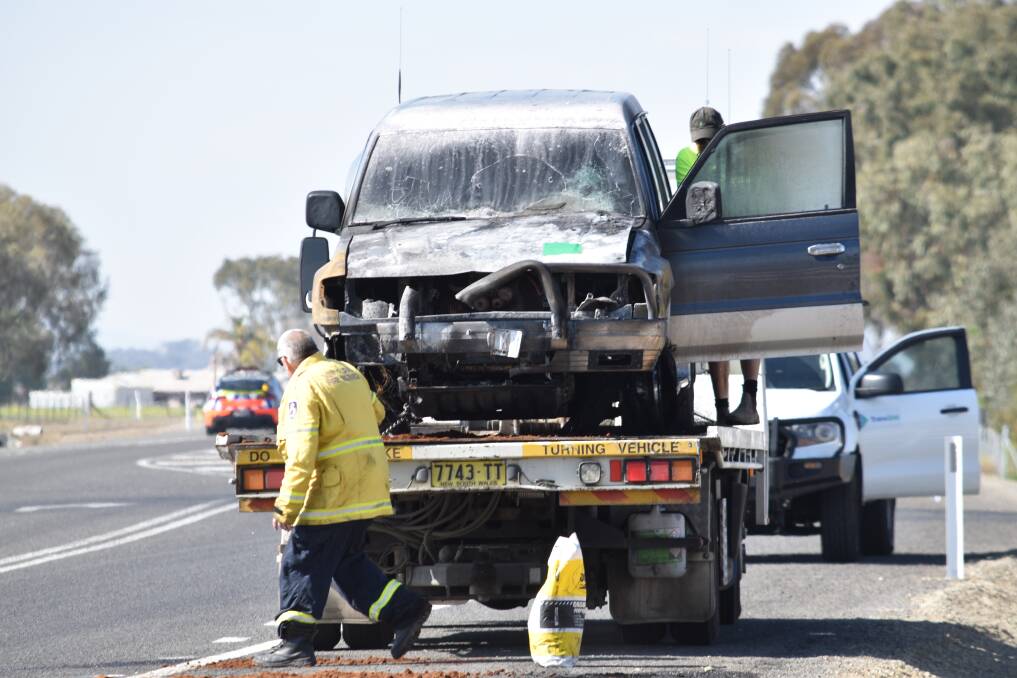 INFERNO: A couple's car burst into flames on the New England Highway. Photo: Ben Jaffrey
