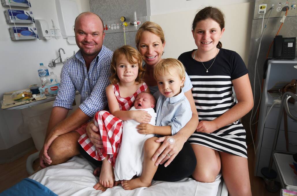 BABY BORN: Andrew and Hannah Windsor with daughters Molly, Matilda, the new baby and son Max, who's still hoping for a baby brother. Photo: Gareth Gardner