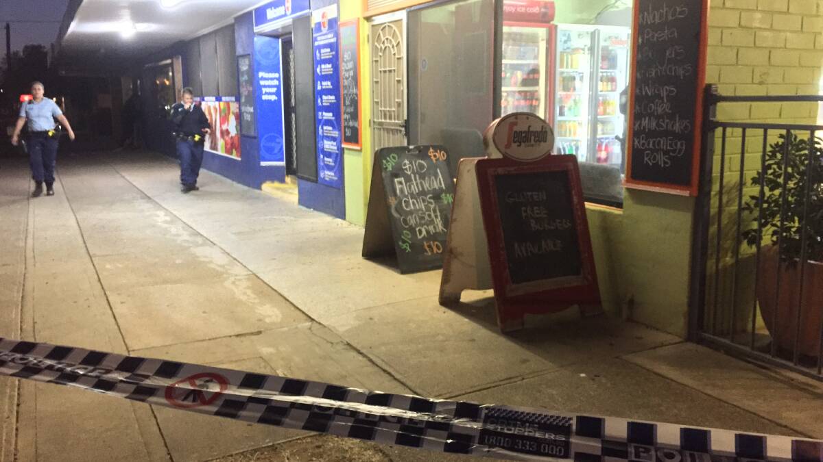 Crime scene: Police cordoned off the Hillvue Superette and the neighbouring cafe on Hillvue Road, Tamworth after the robbery on May 21, 2018. Photo: Gareth Gardner