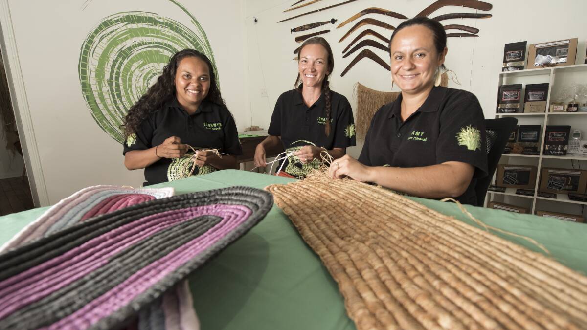 RETURN TO CULTURE: Bronwyn Spearim, Lorrelle Munro and Amy Hammond are part of the core eight weavers. Photo: Peter Hardin