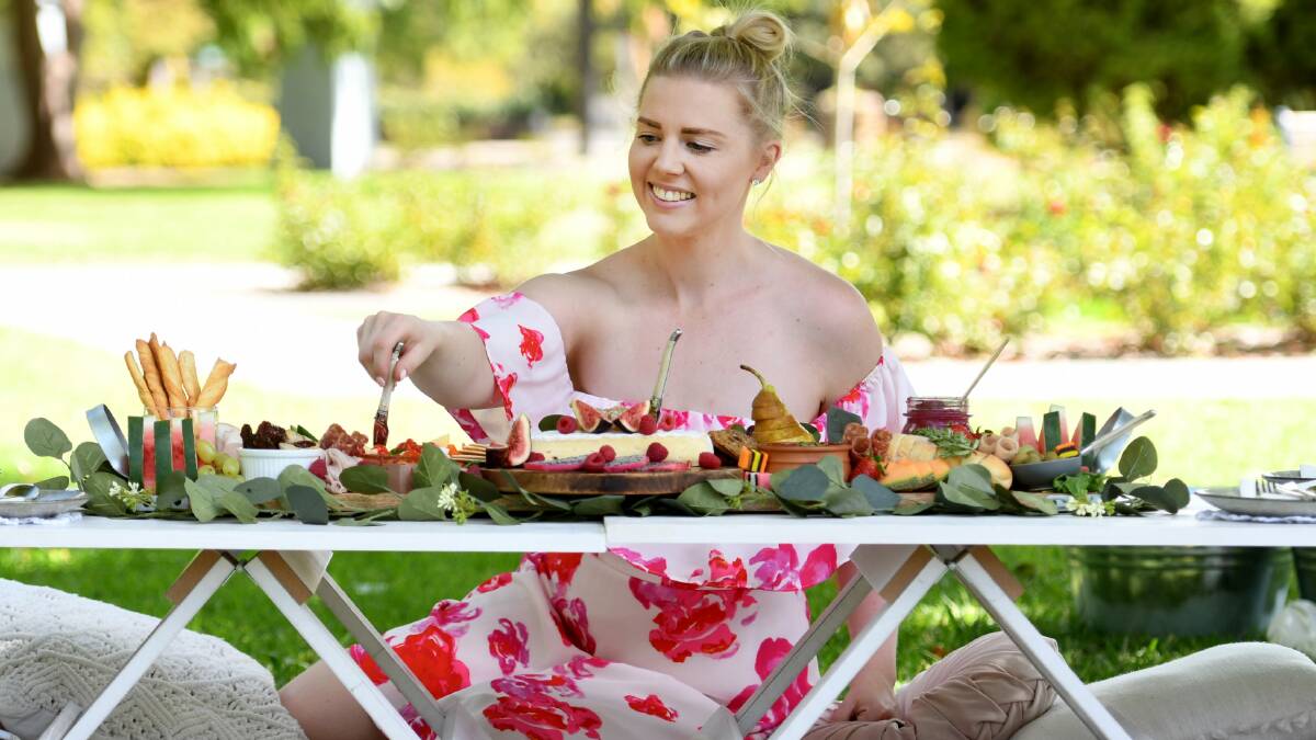 DELICIOUS: My Perfect Picnic business owner Amy Robinson with one of the set ups for a hen's afternoon in the park. Photo: Gareth Gardner