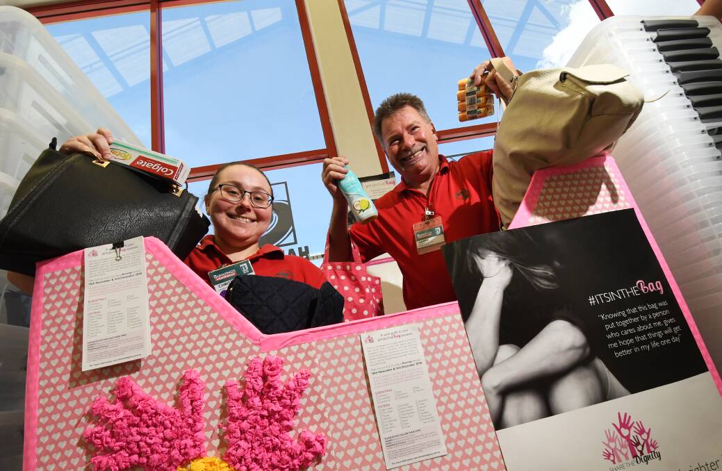 DIGNITY: Bunnings Tamworth staff encourage shoppers. Photo: Gareth Gardner