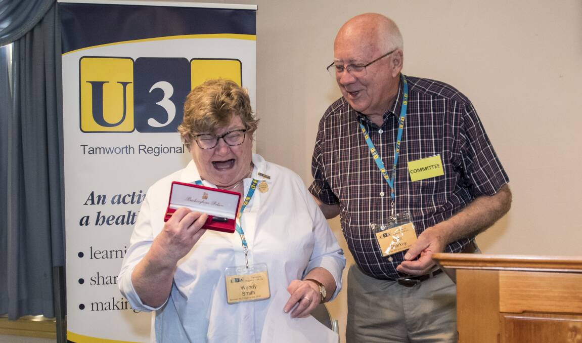 RETIRED: U3A program coordinator Wendy Smith with president John Sharkey being presented with life membership to the university for her significant contributions at the annual general meeting. Photo: Peter Hardin