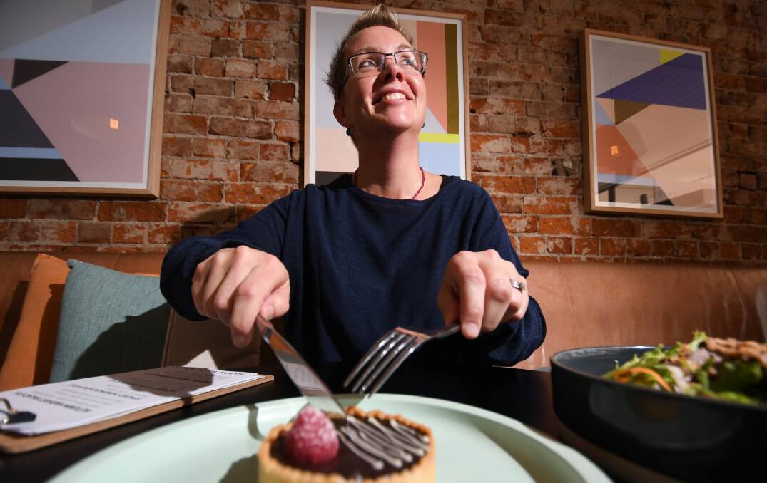 SWEET TREAT: Tamworth Regional Council events coordinator Michaela Stevens enjoys a treat at Sonny's Bakery, one of a number of restaurants taking part in the Taste Tamworth festival at the start of April. Photo: Gareth Gardner