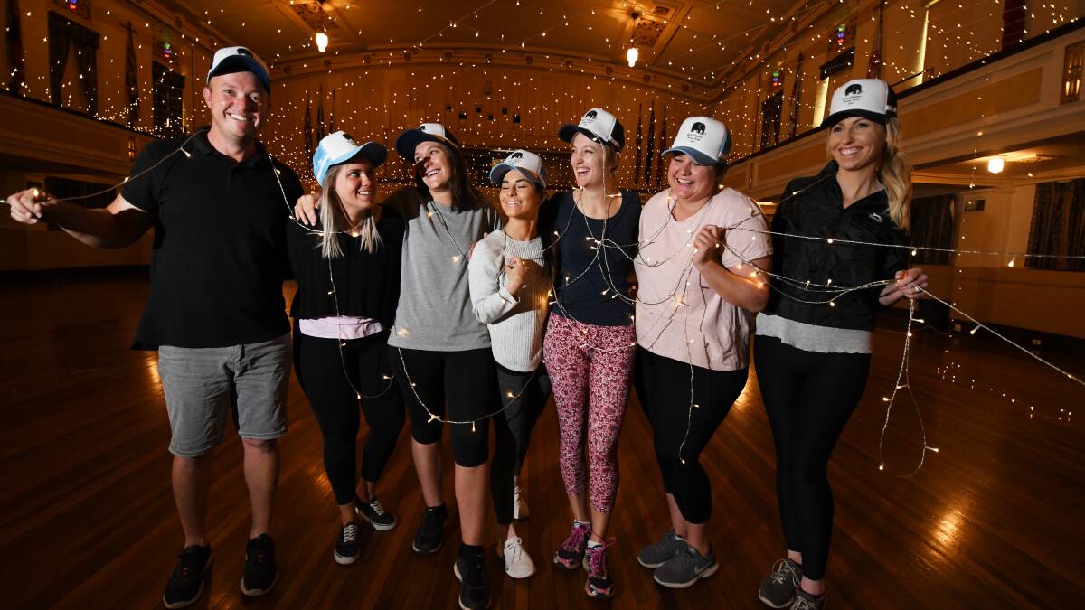 LIT UP: White Elephant Spring Ball set up team Geoff Hill, Meghan Leary, Hiliary Thornberry, Kate Miles, Em SImms, Cass Hill and Tayla Mahony. Photo: Gareth Gardner