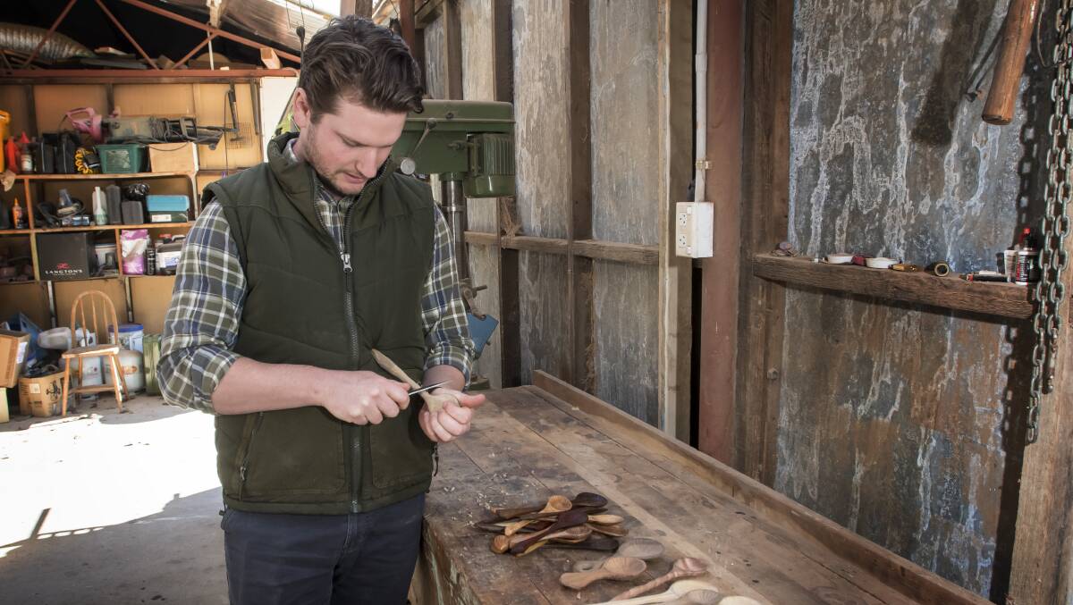 CARVE IT UP: Jack Massey handcrafts each of his spoons individually. Photo: Peter Hardin 