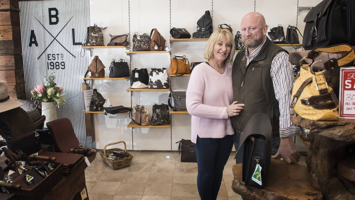 MOVING FORWARD: Aussie Bush Leather owners Belinda Moore and Craig Bates will take their business online. The pair are moving to Forster for a more relaxed lifestyle, less hours and sea change. Photo: Peter Hardin