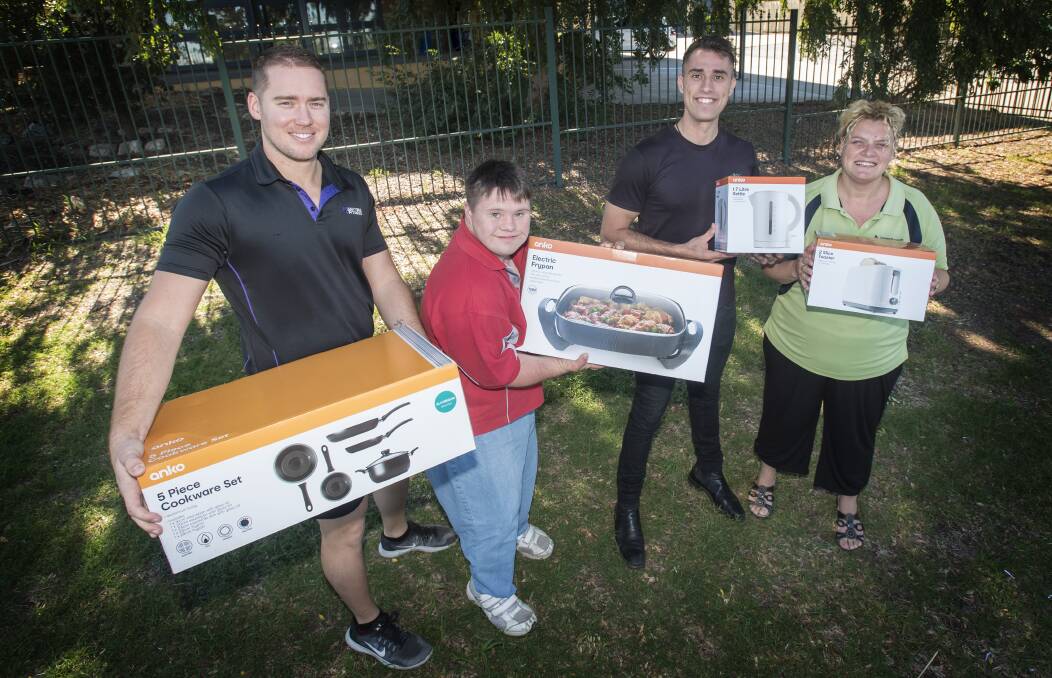 GOOD DEEDS: Anytime Fitness coach Mitch Rolinson, Aaron Hemmings, Pat Burrows and  Tamworth Family Support Service worker Raffy Caldera. Photo: Peter Hardin