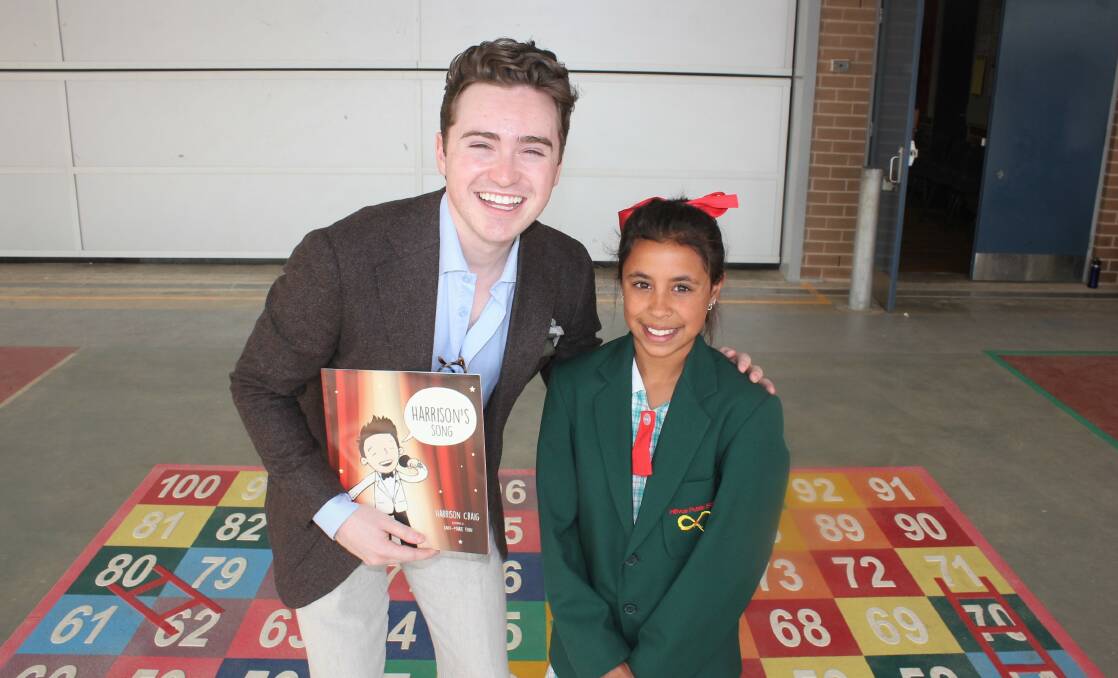 DUET: The Voice 2013 winner Harrison Craig with Hillvue Public School student Annmarie Maguire. Photo: Madeline Link