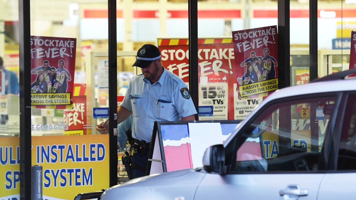 Crime scene: Police and detectives at The Good Guys store after the armed robbery in the Longyard area in June. Photos: Gareth Gardner 