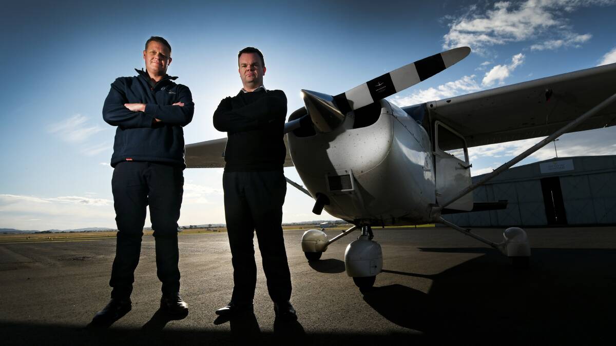 BORDER TEST: Sigma Aerospace director Matthew Wheatley and CAE Tamworth base manager Edward Williamson at Tamworth Airport. Photo: Gareth Gardner 010620GGC03
