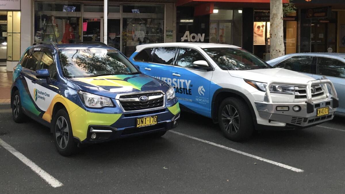 COINCIDENCE: Two competing university vehicles were parked outside Tamworth Regional Council on the night it decided on a formal working group. Photo: Madeline Link