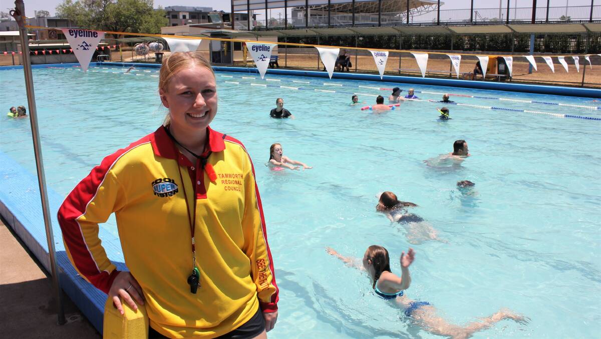 POOL RUSH: Scully Pool lifeguard Billie Mitchell watches on as swimmers enjoy a dip. The West Tamworth pool has seen a 200 per cent increase in visitors in December. Photo: Madeline Link