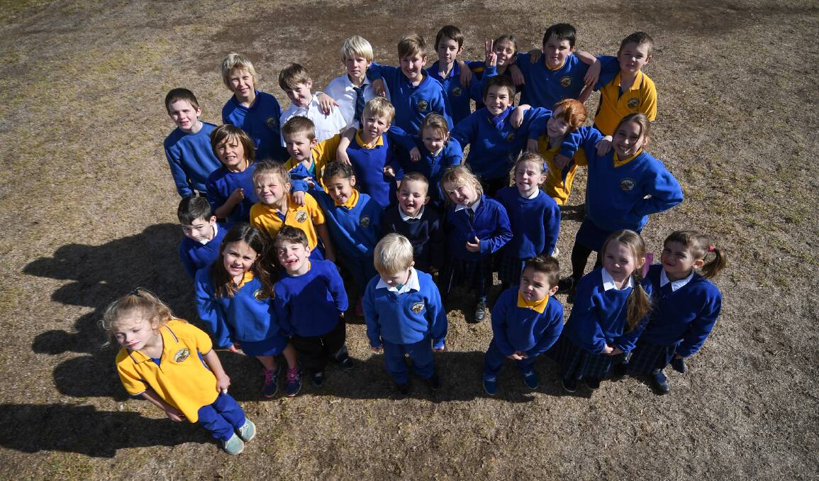 TOO COOL FOR SCHOOL: Woolomin Public School students are busy drawing up designs for the town's only playground, costed at $100,000. Photo: Gareth Gardner