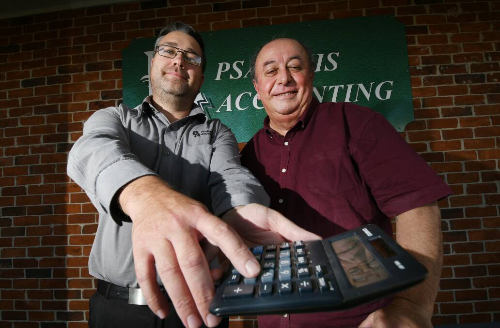 TAX TIME: Psarakis Accounting's Mat Old and Terry Psarakis. Photo: Gareth Gardner 300621GGE03