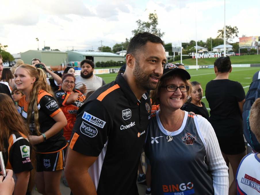 TIGER TIME: Wests Tigers player Benji Marshall with a Tamworth fan earlier in the year.
