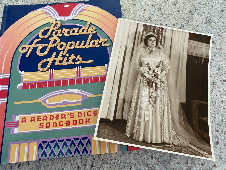 SEARCH IS ON: The photo of the bride (right) fell out of the secondhand copy of the songbook. Photo: Veronica Underwood