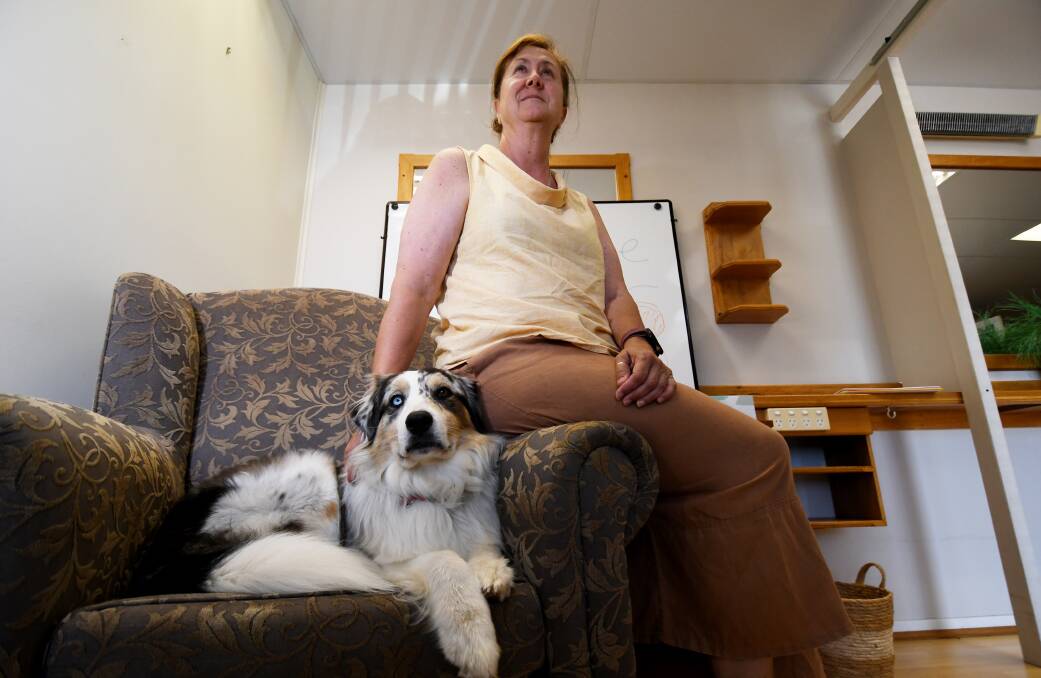 PAWS FOR THOUGHT: Therapy dog Tilly with accredited mental health social worker Karen Clark-Dickson. Photo: Gareth Gardner 