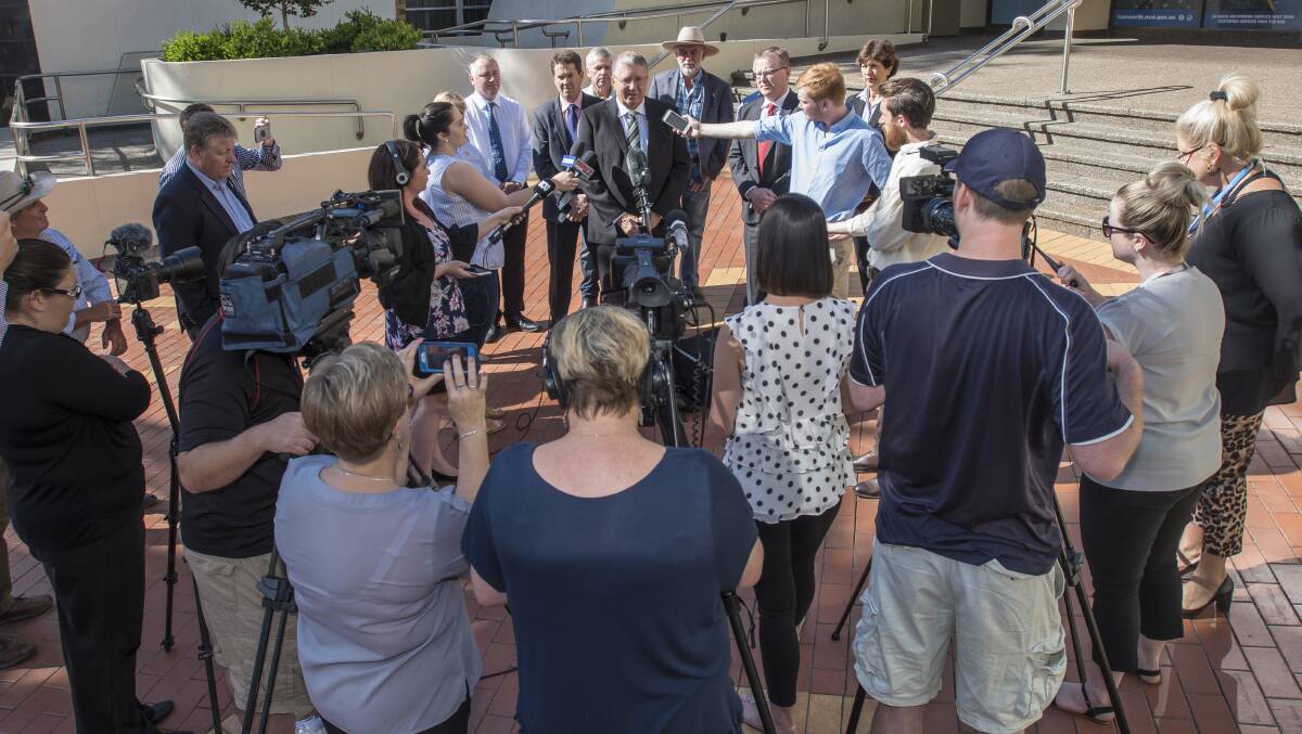 HUGE ANNOUNCEMENT: Tamworth mayor Col Murray at the centre of a media scrum at the Virgin announcement last year. Photo: Peter Hardin 311018PHA022