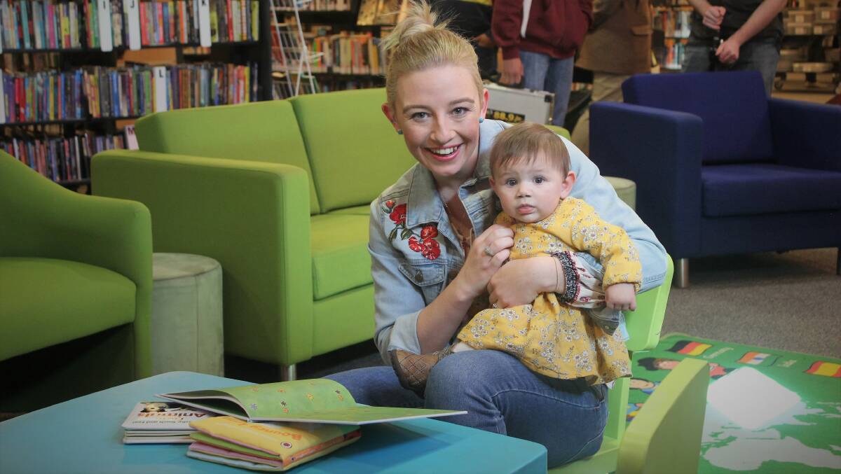 NEW CHAPTER: Country music singer Ashleigh Dallas with her daughter Harriet at Tamworth City Library to launch her role as an ambassador for Dolly Parton's Imagination Library. Photo: Madeline Link