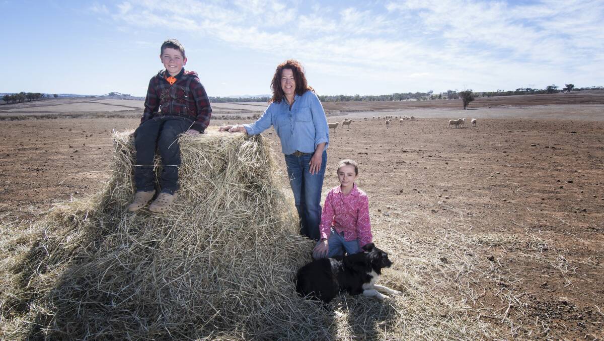 INCREDIBLE SUPPORT: Loomberah property owner Karen Nugent with her son Riley and daughter Caitlin battle the drought. Photo: Peter Hardin