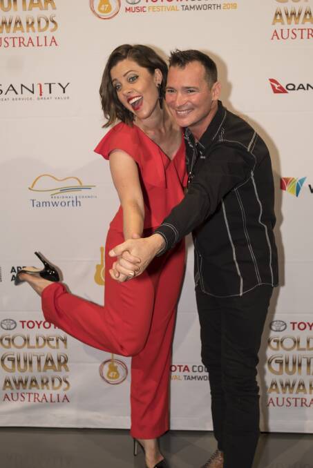 ALL SMILES: Amber Lawrence and Adam Brand will host the 2019 Toyota Golden Guitar Awards in Tamworth. Photo: Peter Hardin