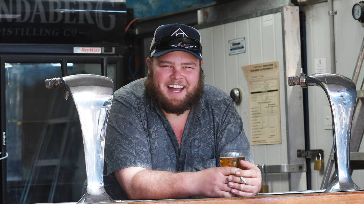 ALL SMILES: Toyota Star Maker winner Brad Cox stops for a beer. Photo: Gareth Gardner