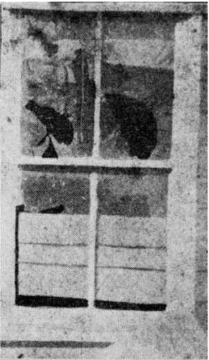 SMASHED: Windows at the Bowen residence were eventually boarded up to stop the 'ghost' breaking them. Photo: Sunday Times, 1921