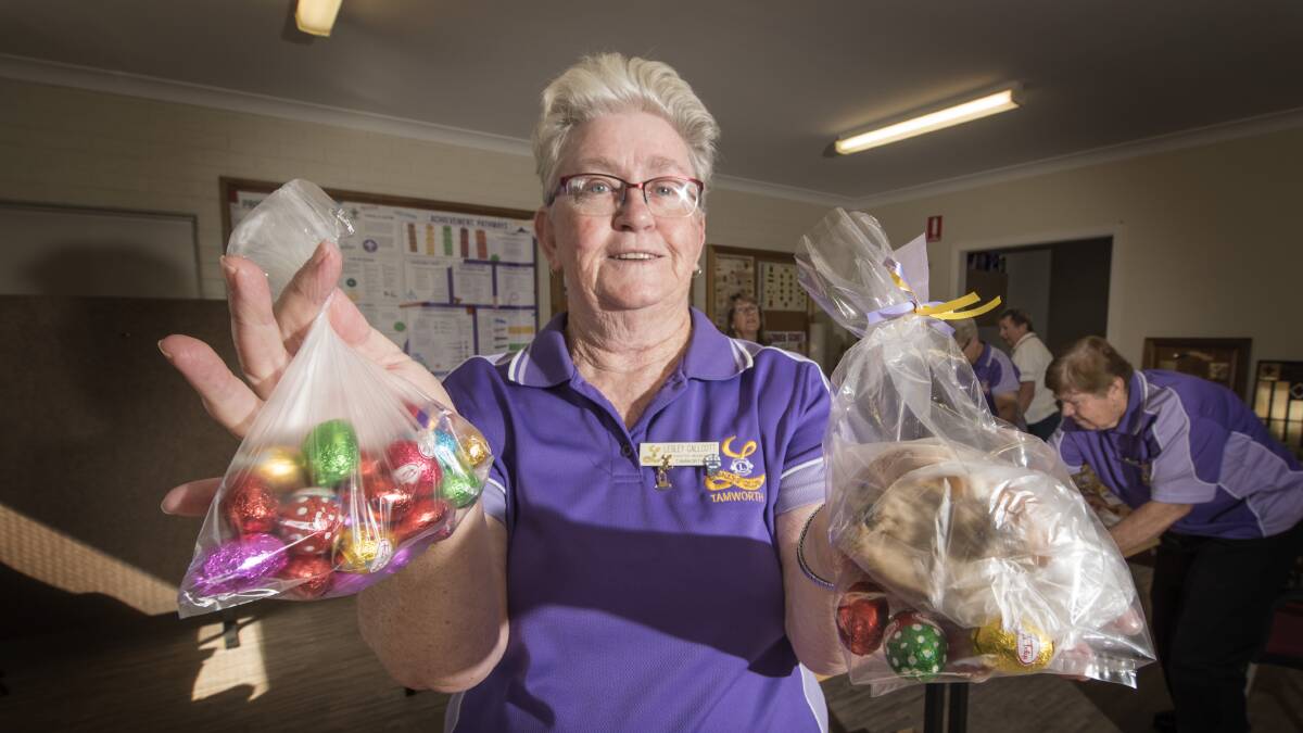 EASTER TREAT: Lioness Lesley Callcott packs a special treat for Meals on Wheels clients. Photo: Peter Hardin