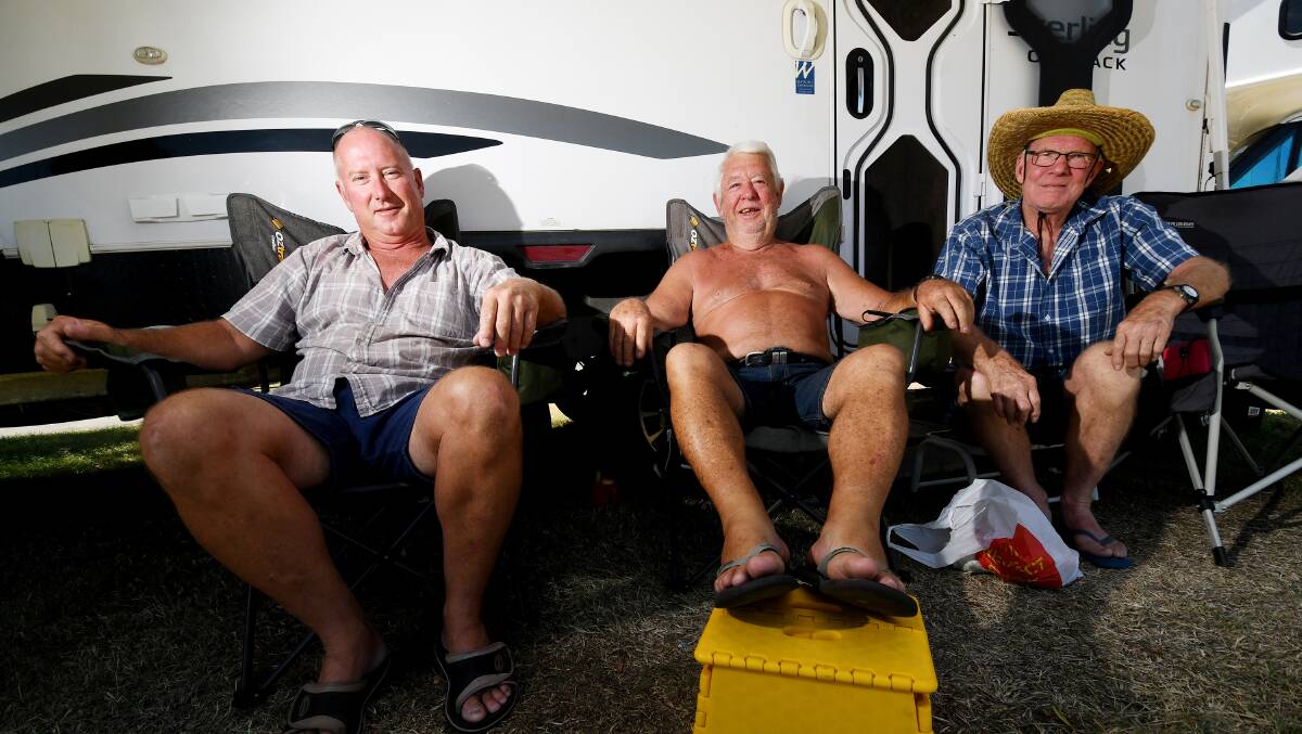 PARKED UP: Mark Eggins, Wayne Leary and Malcolm Leo prepare for Tamworth Country Music Festival with a good spot by the river. Photo: Gareth Gardner 030119GGD02